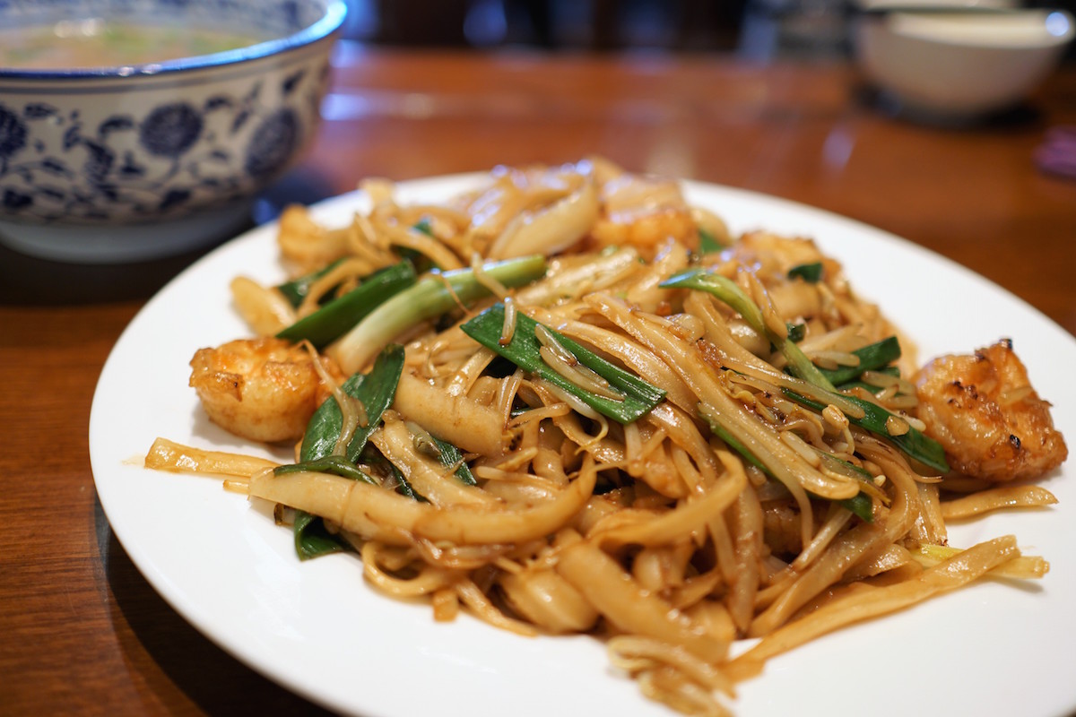 Stir-fried shrimp tossed with shaved noodles at Kuen Noodle House