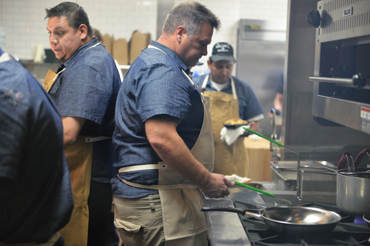 Teddy Lopez (left) and Ronnie Killen (center) in the STQ kitchen. Photo by Dragana Harris