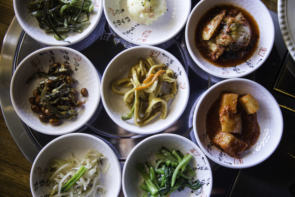 A spread of banchan from Korean restaurant Lucky Palace in Houston. Photo by Becca Wright