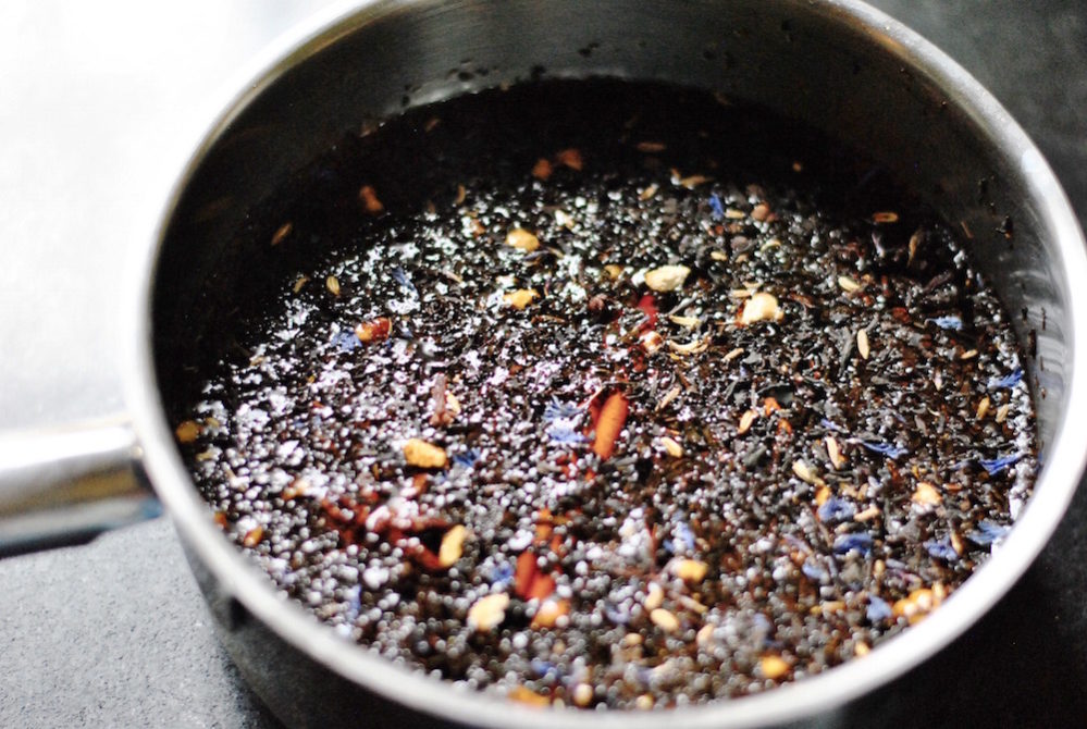 Create a marinade using tea, spices and soy or fish sauce.