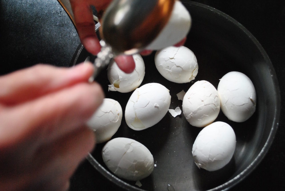 Crack the shells on your hard-boiled eggs before soaking them in the tea marinade.